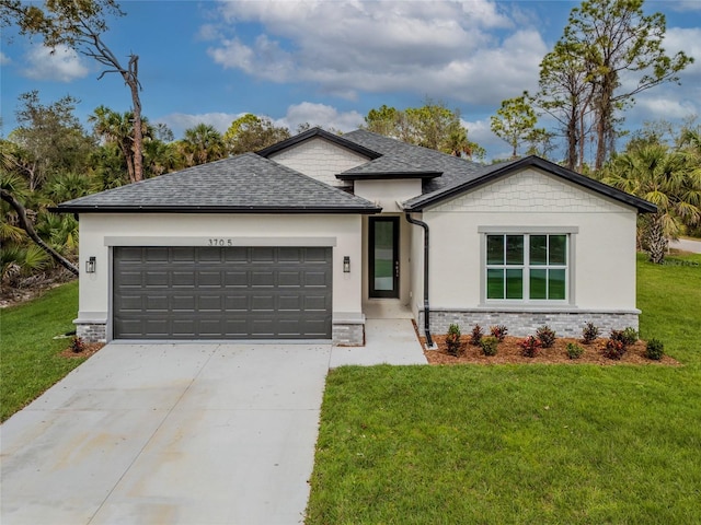 view of front of home featuring a garage, concrete driveway, a front lawn, and roof with shingles