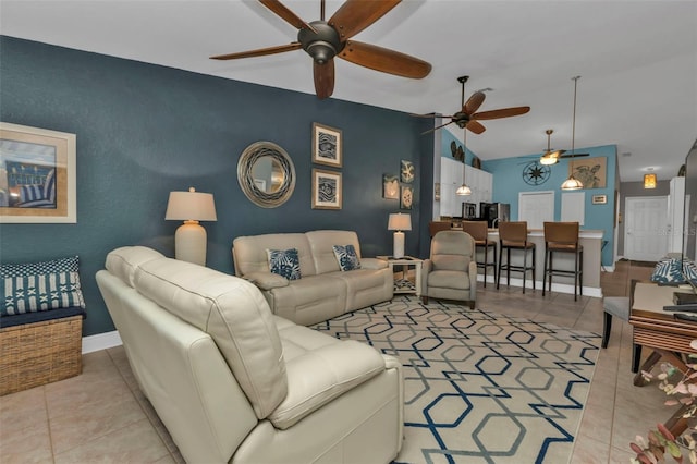 living room featuring light tile patterned floors and vaulted ceiling