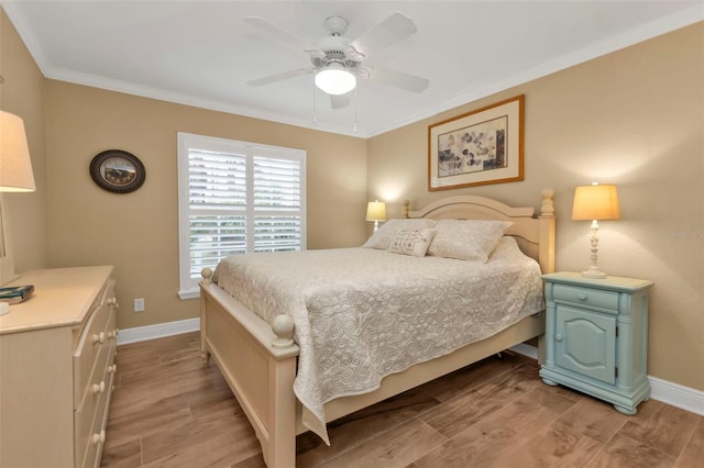 bedroom with ceiling fan, light hardwood / wood-style flooring, and ornamental molding