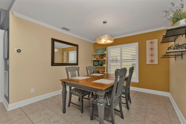 tiled dining space with crown molding