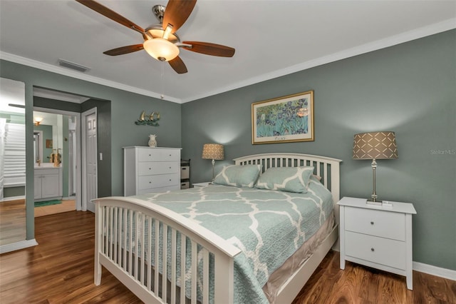 bedroom with connected bathroom, hardwood / wood-style flooring, ceiling fan, and crown molding