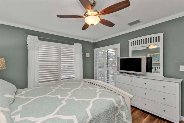 bedroom featuring hardwood / wood-style floors, ceiling fan, and crown molding