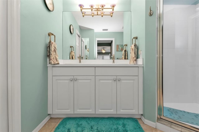 bathroom with tile patterned floors, vanity, and a shower with shower door