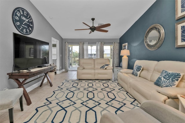 living room with ceiling fan, light tile patterned floors, and vaulted ceiling