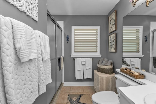 2000 Bal Harbor Blvd Unit 321, Punta Gorda, FL 33950 - bathroom with vanity, toilet, baseboards, tile patterned floors, and a shower stall