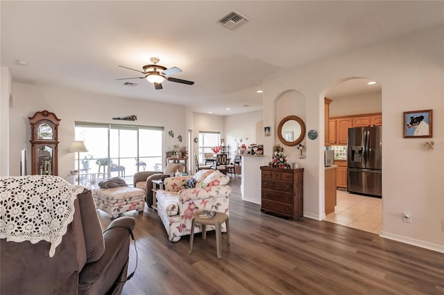 living room with hardwood / wood-style floors and ceiling fan