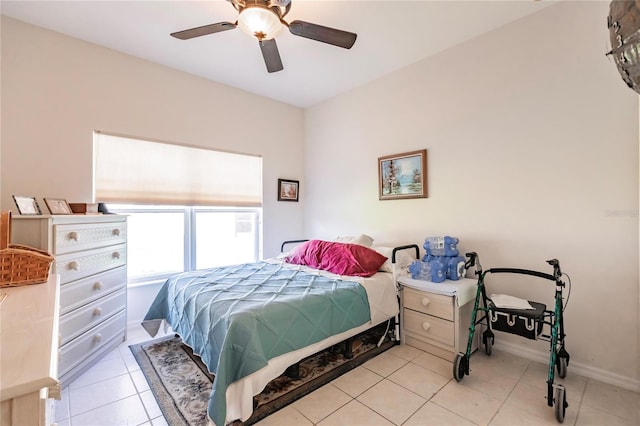 tiled bedroom with ceiling fan