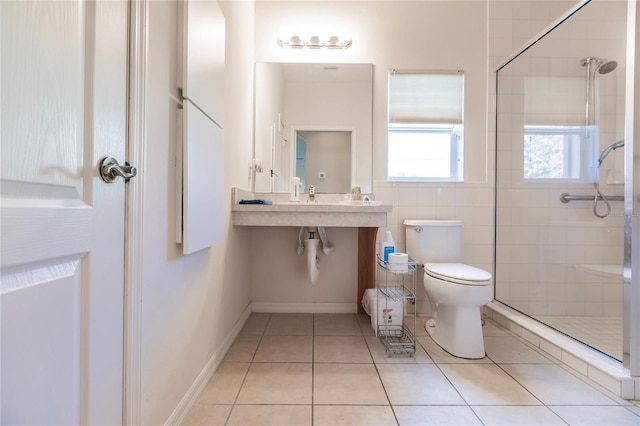 bathroom with walk in shower, toilet, and tile patterned flooring