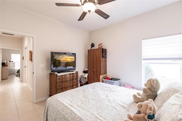 bedroom featuring ceiling fan and light tile patterned floors