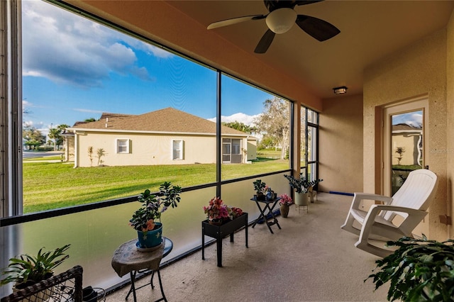 sunroom / solarium with ceiling fan