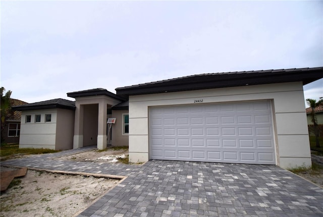 view of front of home with a garage