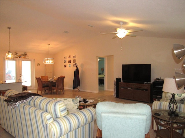 living room with ceiling fan and vaulted ceiling