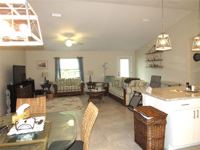 tiled dining space featuring ceiling fan