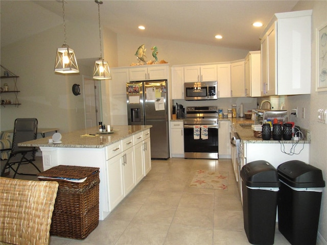 kitchen with white cabinetry, a center island, lofted ceiling, and stainless steel appliances