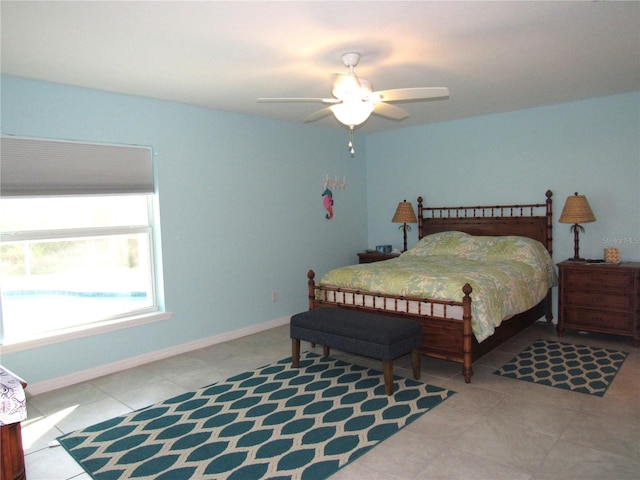 tiled bedroom with ceiling fan