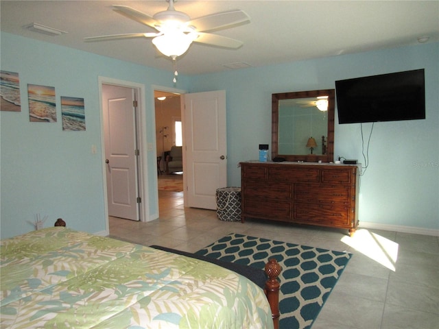 bedroom with ceiling fan and light tile patterned floors