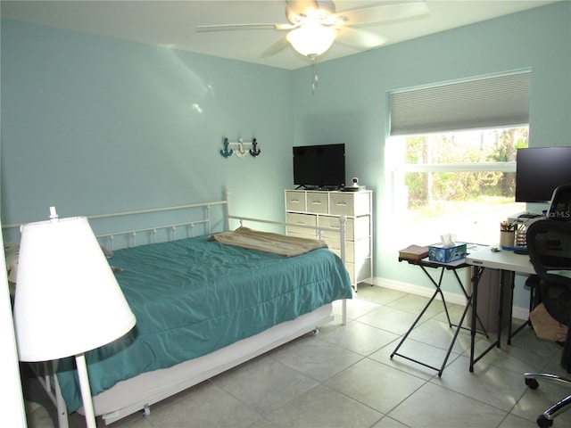 tiled bedroom with ceiling fan