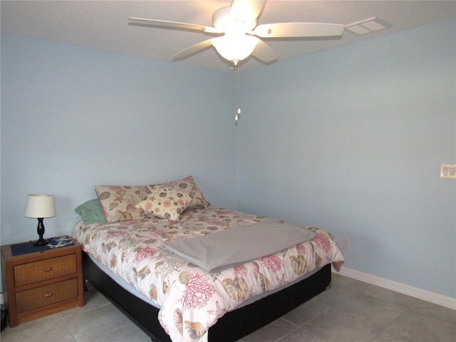 bedroom with light tile patterned flooring and ceiling fan