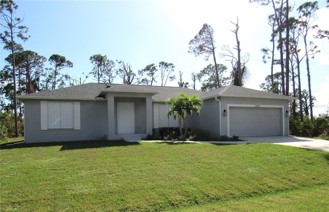 ranch-style house featuring a garage and a front yard