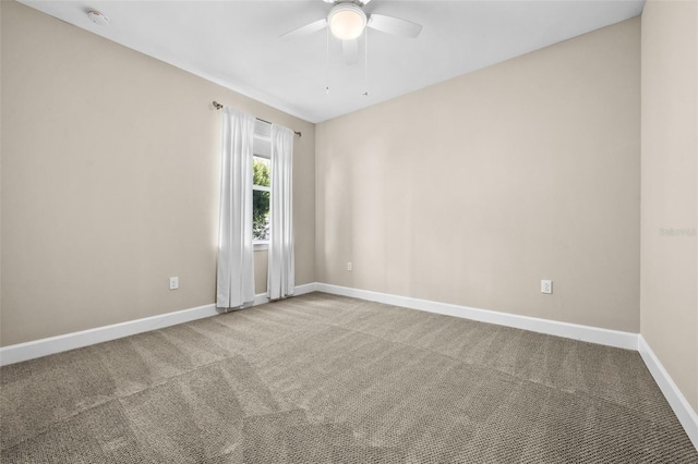 empty room with carpet flooring and ceiling fan