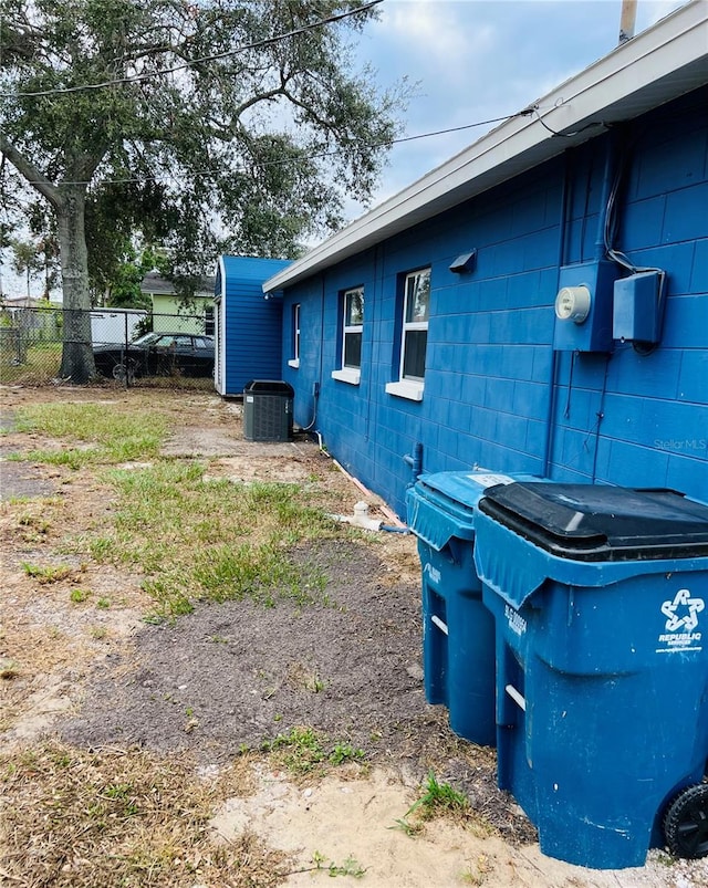 view of side of home featuring central air condition unit