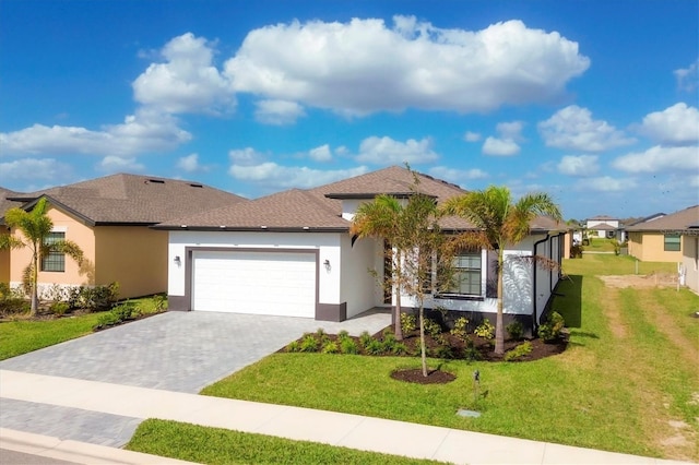 view of front facade with a front lawn and a garage