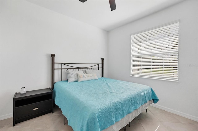 tiled bedroom with ceiling fan