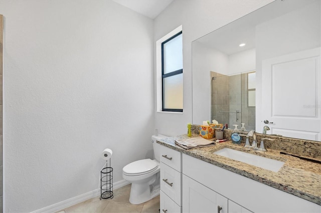 bathroom featuring toilet, tile patterned flooring, vanity, and a shower with door