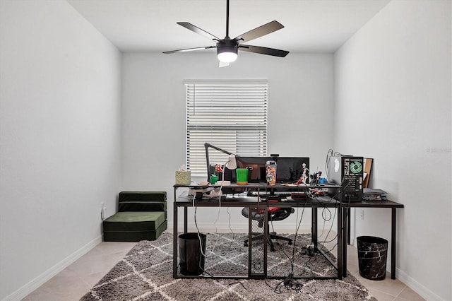 home office with ceiling fan and light tile patterned floors