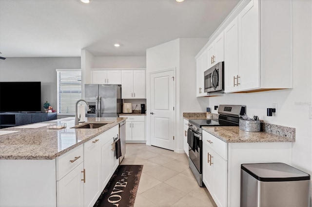 kitchen with sink, appliances with stainless steel finishes, and white cabinetry