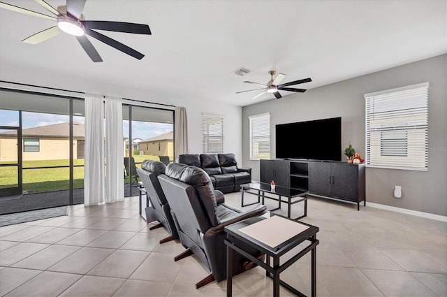 living room featuring ceiling fan and light tile patterned floors