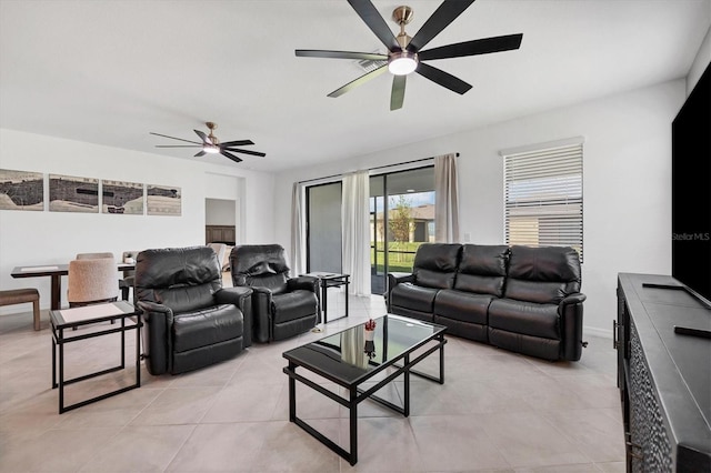 living room featuring ceiling fan and light tile patterned floors