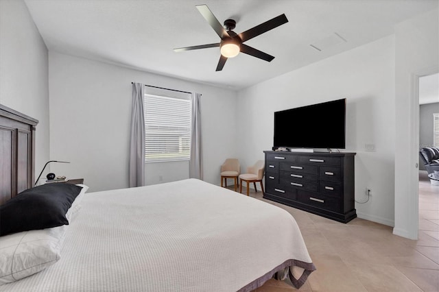 bedroom with light tile patterned floors and ceiling fan