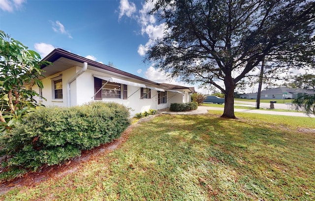 view of property exterior featuring a yard