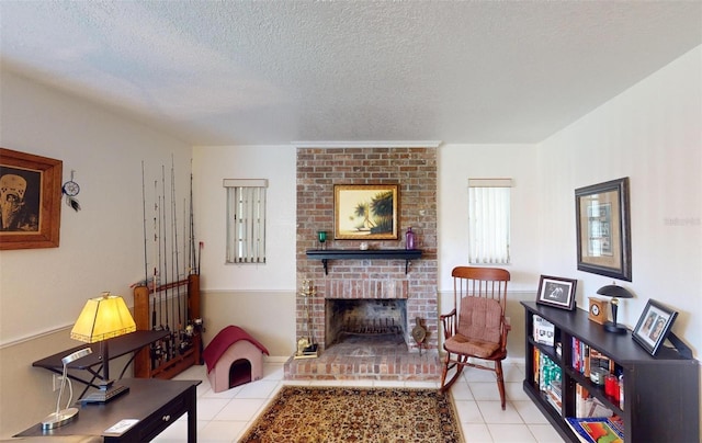 living room featuring a fireplace, light tile patterned floors, and a textured ceiling