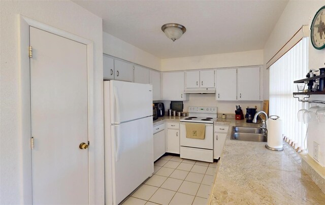 kitchen featuring white cabinetry, light tile patterned flooring, white appliances, and sink