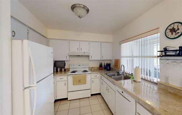 kitchen featuring light tile patterned floors, white appliances, white cabinetry, and sink