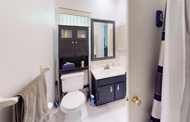 bathroom with vanity and toilet