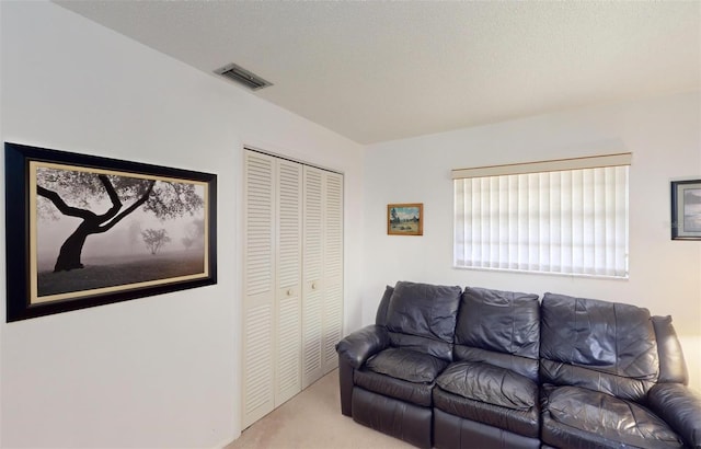 living room featuring light carpet