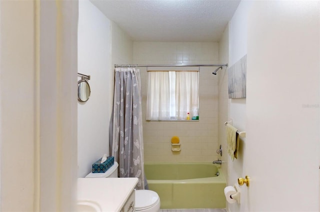 full bathroom featuring vanity, shower / tub combo, a textured ceiling, and toilet