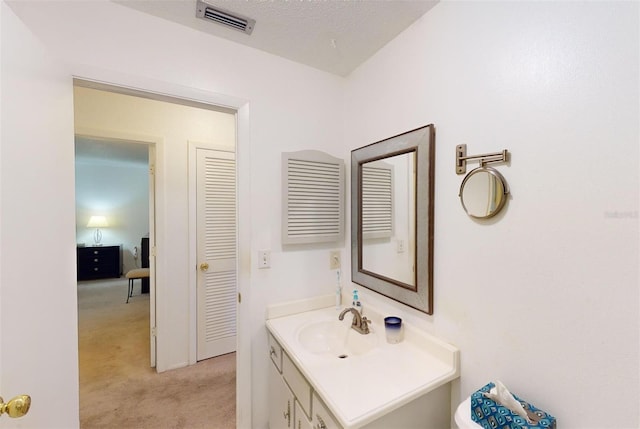 bathroom featuring vanity and a textured ceiling