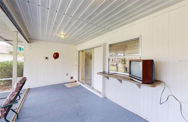 unfurnished sunroom featuring a wealth of natural light