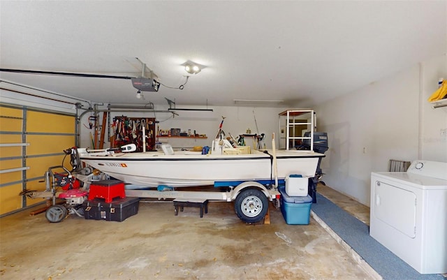 garage featuring washer / dryer and a garage door opener