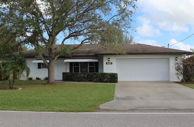 single story home featuring a front lawn and a garage