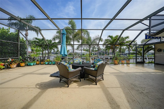 view of patio featuring a lanai