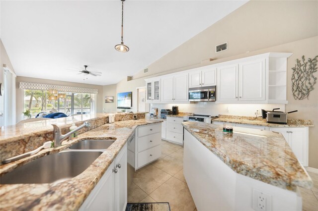 kitchen with hanging light fixtures, sink, ceiling fan, white cabinetry, and appliances with stainless steel finishes