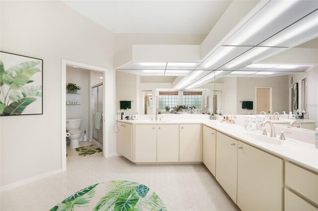 bathroom featuring walk in shower, vanity, and toilet