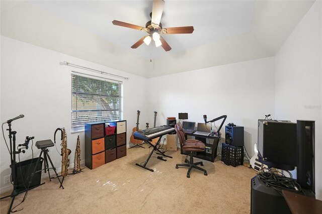 office space featuring ceiling fan, vaulted ceiling, and carpet