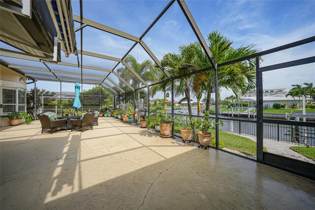 unfurnished sunroom with a water view