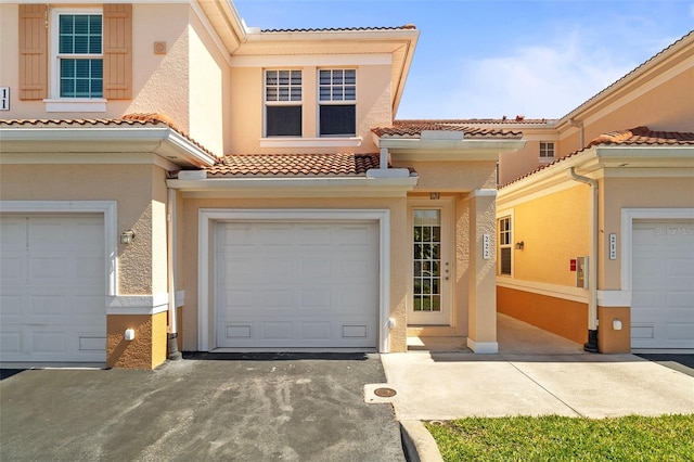 mediterranean / spanish house with a garage